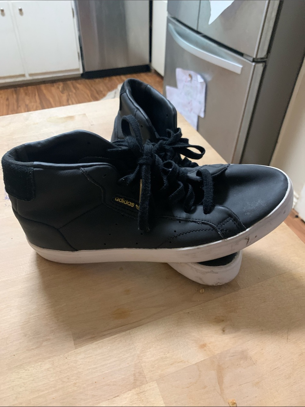 adidas Women's Black Mid-Top Sneakers with Gold Logo and White Sole